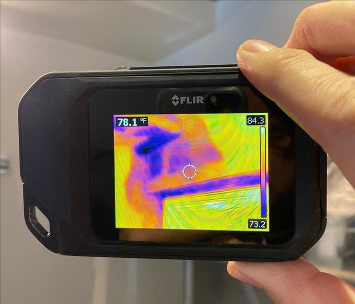 using an infrared camera to help see a wet wall and ceiling in a home that has fresh water damage