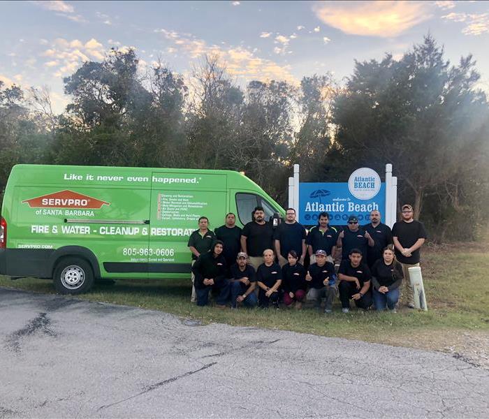 SERVPRO crew in front of a large Atlantic Beach sign 