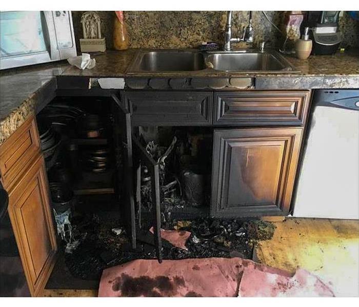 Fire damage to kitchen cabinets.