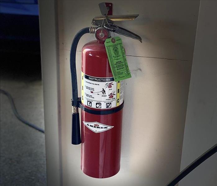 fire extinguisher hanging on the wall 